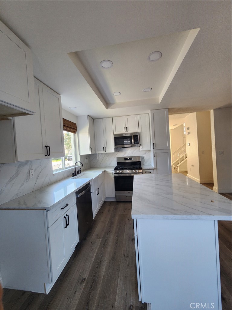Kitchenwith cabinets-range-microwave-dishwasher. - 168 Greenmoor 72, Irvine CA 92614 - photo 28