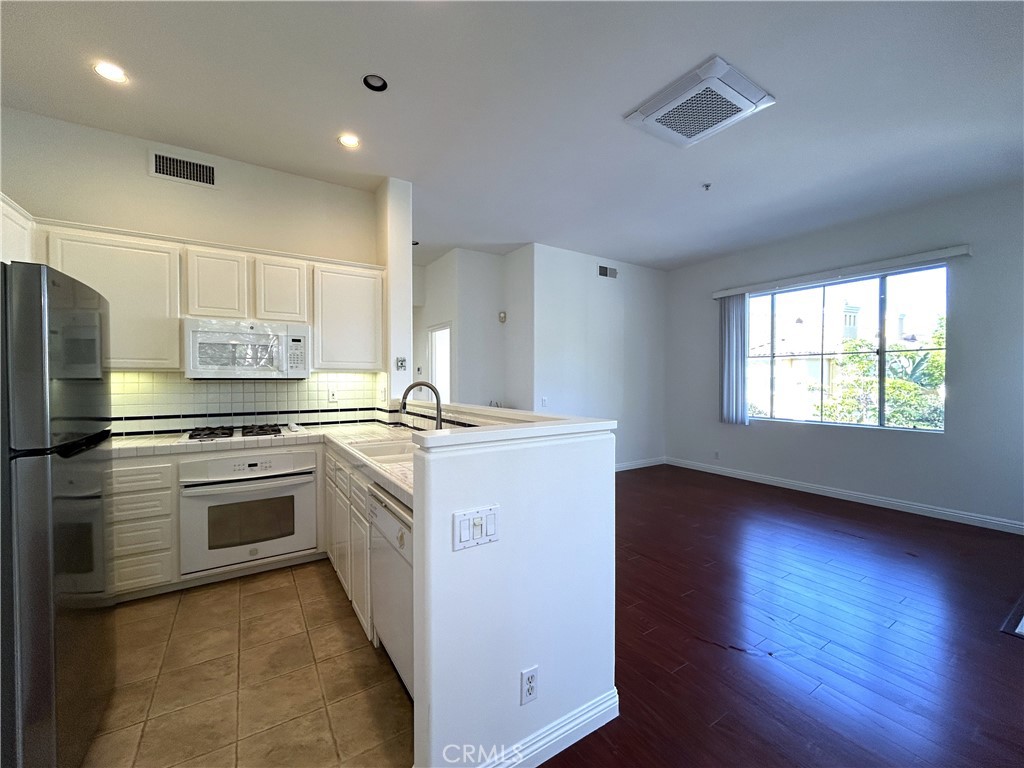 Kitchen to Living Room - 1701 Reggio Aisle, Irvine CA 92606 - photo 3
