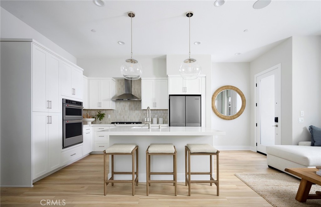 Photos uploaded are of the model representing the floor plan and are to demonstrate furniture layout. Furniture pictured - 171 Moody, Irvine CA 92618 - photo 4