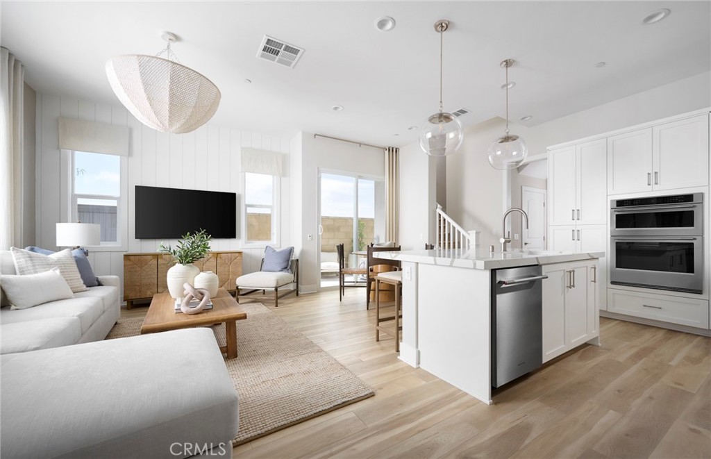 Photos uploaded are of the model representing the floor plan and are to demonstrate furniture layout. Furniture pictured - 171 Moody, Irvine CA 92618 - photo 6