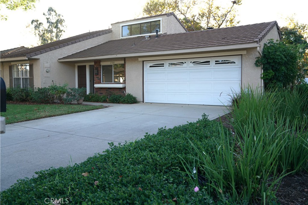 Front of house and driveway - 17301 Peach, Irvine CA 92612 - photo 1