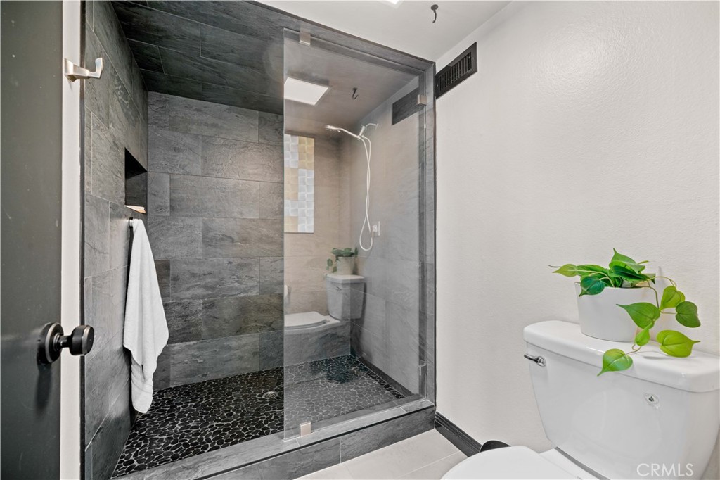 Primary Bathroom shower with privacy door - 18 Rana 58, Irvine CA 92612 - photo 24