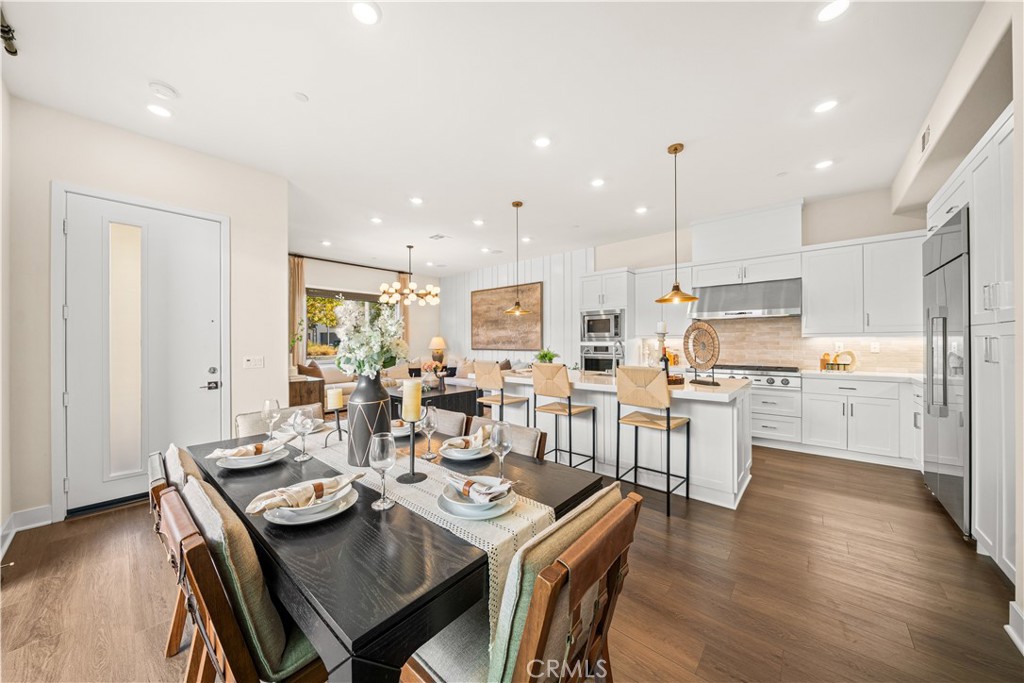 Premium wood flooring in all common areas and upgraded carpeting in every bedroom - 187 Sawbuck, Irvine CA 92618 - photo 6