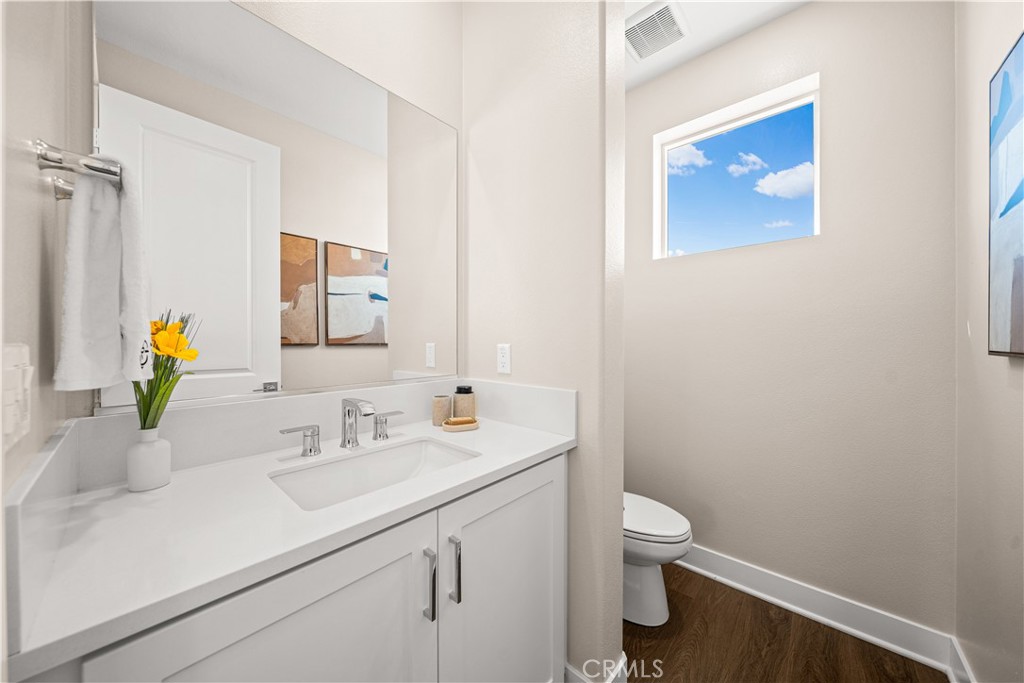 A HALF BATHROOM AND INDEPENDENT AIR CONDITIONING on top floor add comfort and convenience. - 187 Sawbuck, Irvine CA 92618 - photo 60