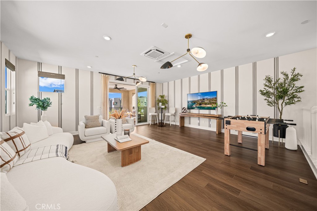 A HUGE ENTERTAINMENT LOFT/GREAT ROOM on the top floor, opening to A COVERED BALCONY WITH SCENIC MOUNTAIN VIEWS, RECESSED - 187 Sawbuck, Irvine CA 92618 - photo 51