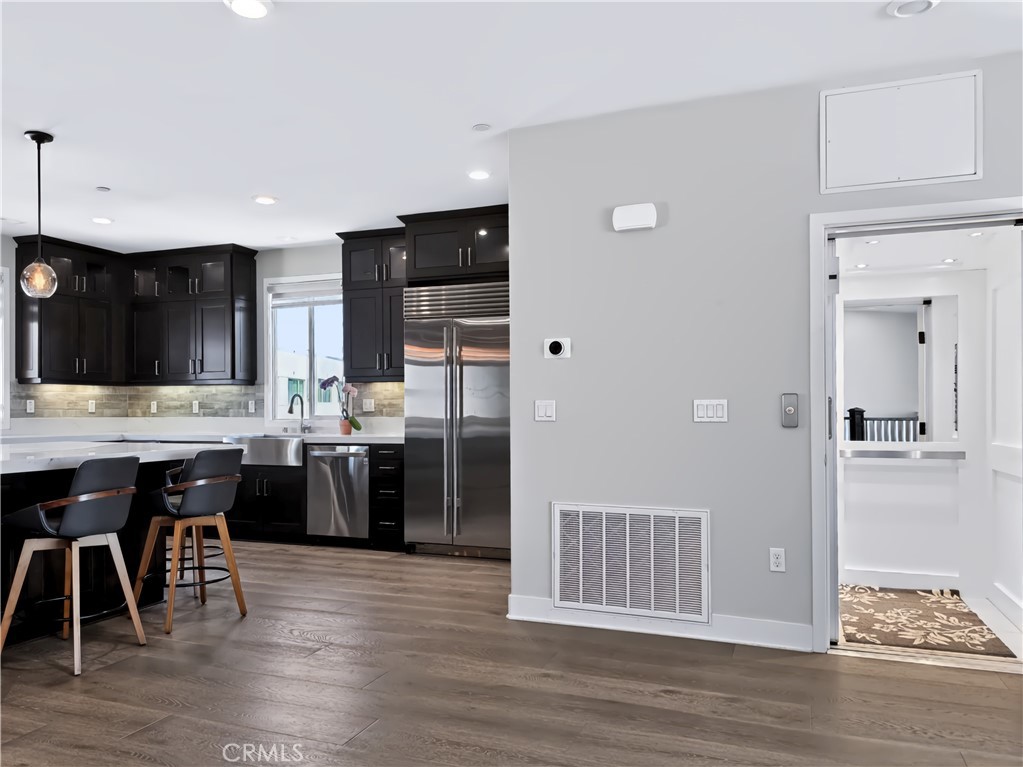 Elevator next to kitchen/great room. - 195 Stellar, Irvine CA 92618 - photo 5