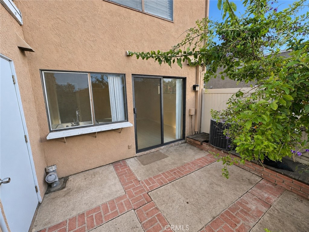 Patio with newer vinyl fencing. Patio has door to carport - 2 Greenleaf, Irvine CA 92604 - photo 16
