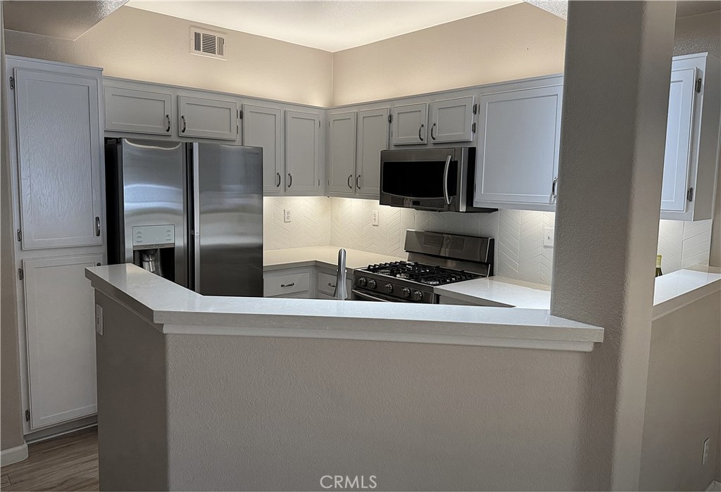 Kitchen open to the Living Room - 204 Falcon, Irvine CA 92618 - photo 4