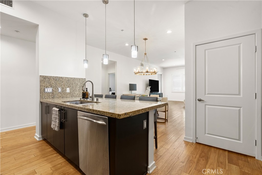 Spacious kitchen island perfect for casual dining, entertaining guests, or gathering with family. - 21 Gramercy 102, Irvine CA 92612 - photo 9