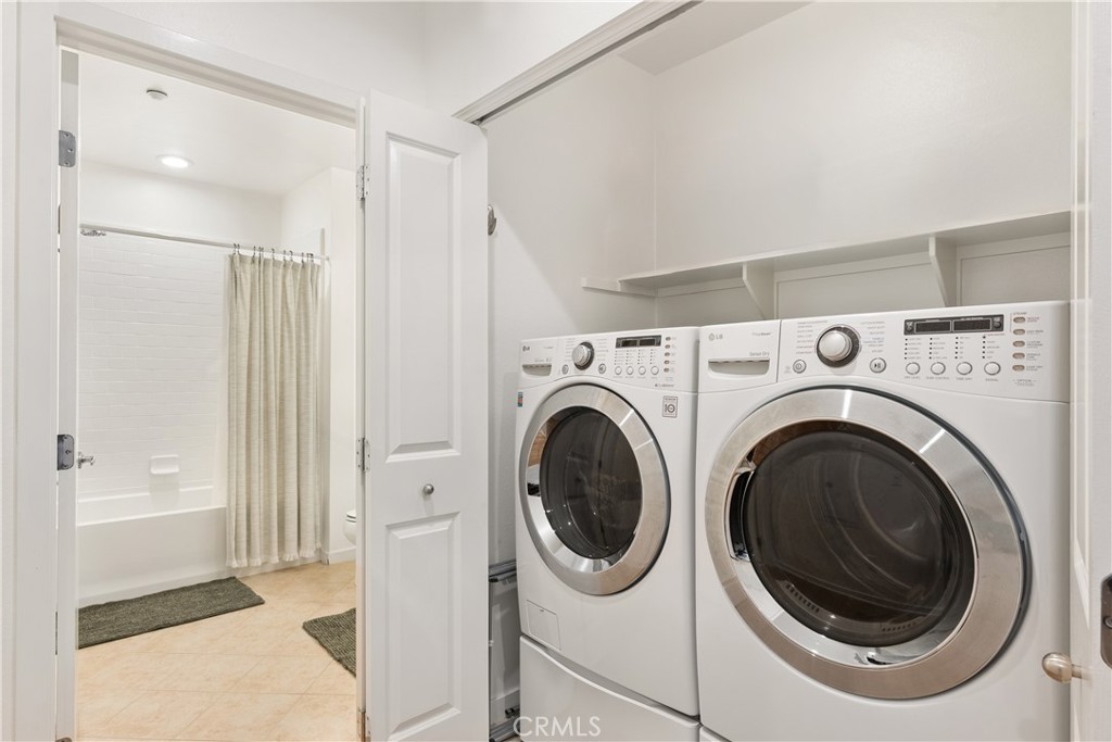 Dedicated laundry area with full size washer and dryer for added convenience. - 21 Gramercy 102, Irvine CA 92612 - photo 13