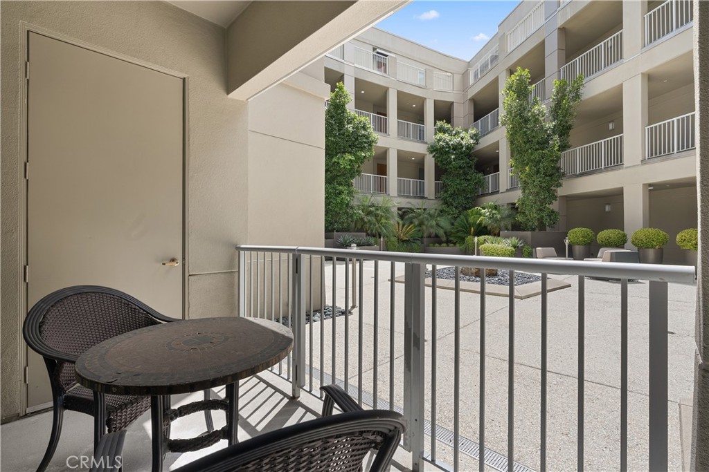 Private covered patio space perfect for relaxing and enjoying indoor outdoor living. - 21 Gramercy 102, Irvine CA 92612 - photo 19