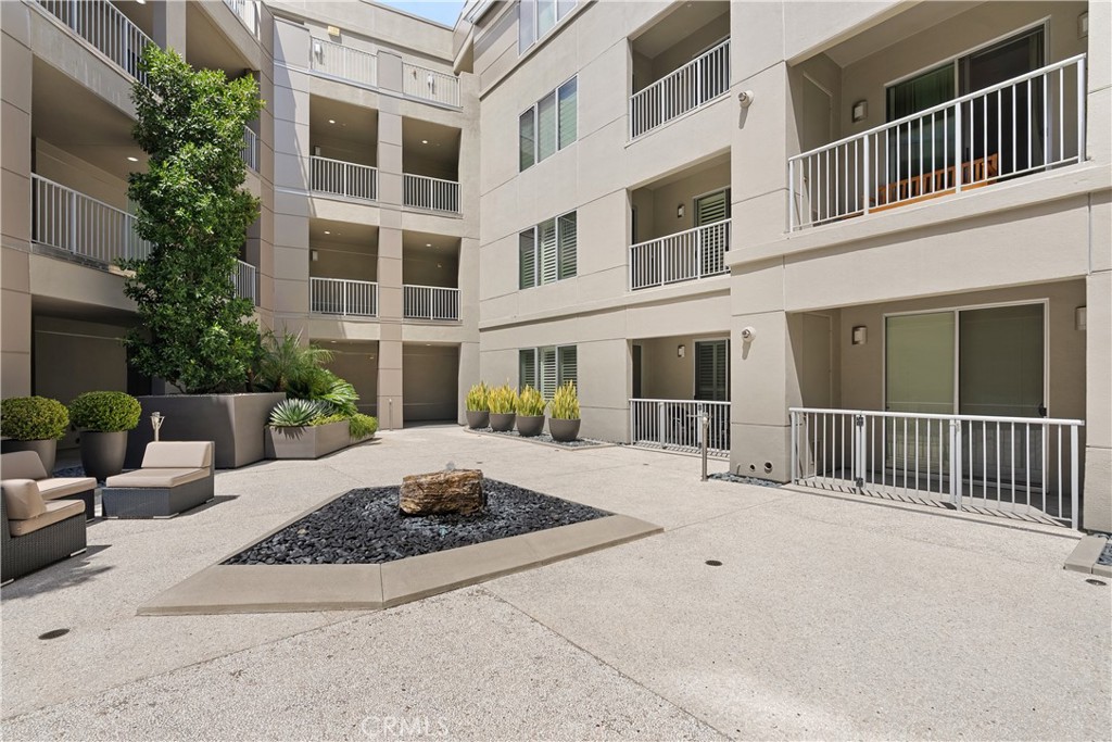 Resort style courtyard offering a peaceful and beautifully maintained community setting. - 21 Gramercy 102, Irvine CA 92612 - photo 20