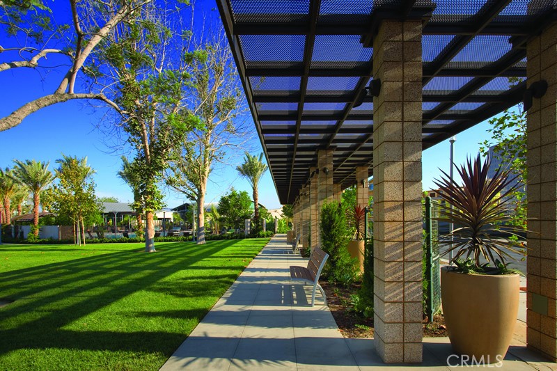 Lush palm lined community grounds creating a true Southern California resort atmosphere. - 21 Gramercy 102, Irvine CA 92612 - photo 23