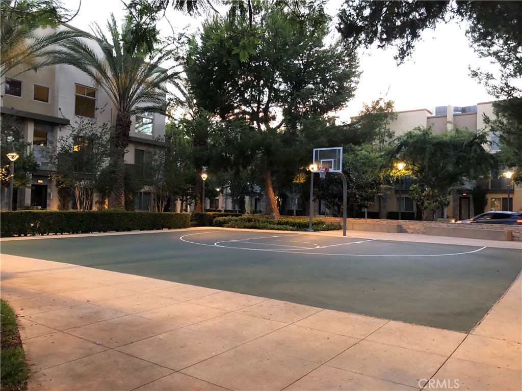 Community basketball court offering fun outdoor recreation just steps from your home. - 21 Gramercy 102, Irvine CA 92612 - photo 26