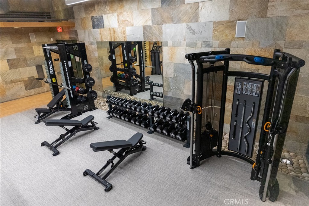 Fully equipped fitness center offering convenient onsite wellness and workout options. - 21 Gramercy 102, Irvine CA 92612 - photo 28