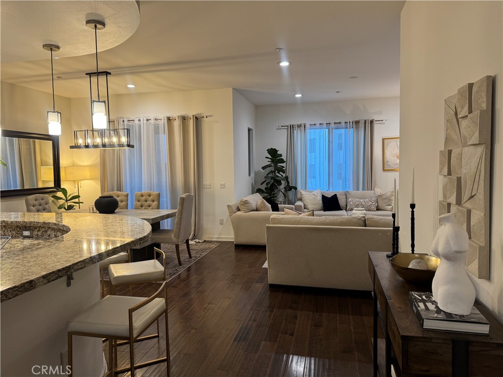 Granite counter tips and cherry wood flooring. - 21 Gramercy 218, Irvine CA 92612 - photo 5