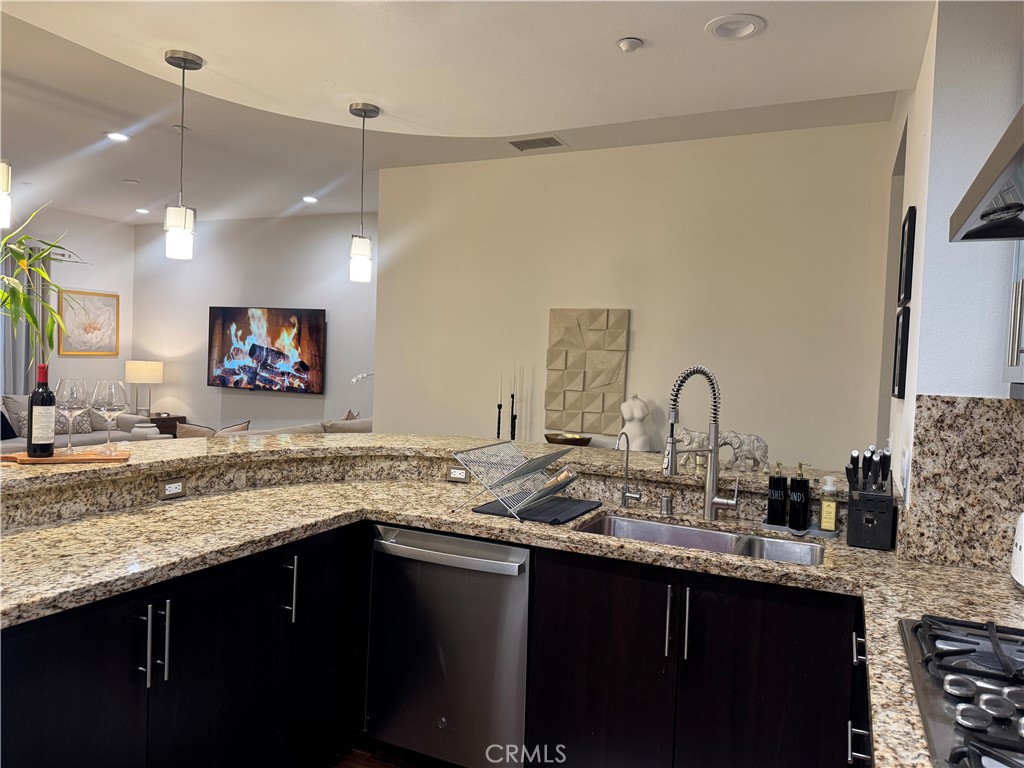 kitchen opens to the living and dinning area. - 21 Gramercy 218, Irvine CA 92612 - photo 8