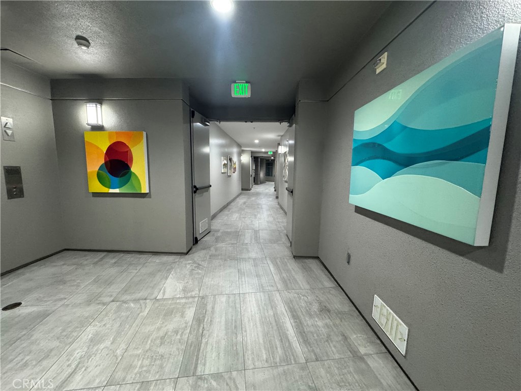 Tile flooring on all levels of the building. - 21 Gramercy 218, Irvine CA 92612 - photo 19
