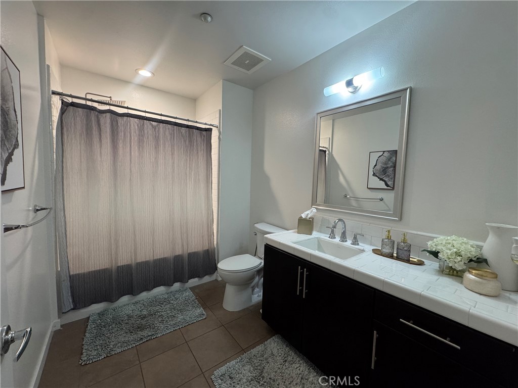 Bath room # 3 with a shower in the bath - 21 Gramercy 218, Irvine CA 92612 - photo 30