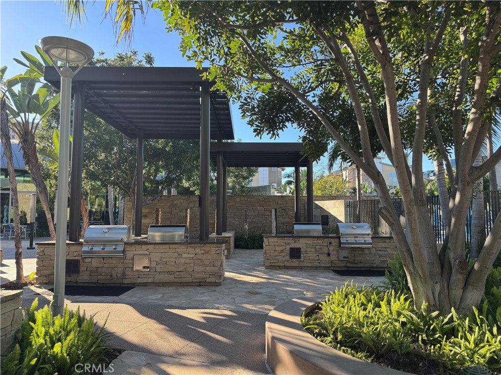 Many BBQ grills for resident use with tables for entertaninment. - 21 Gramercy 218, Irvine CA 92612 - photo 36