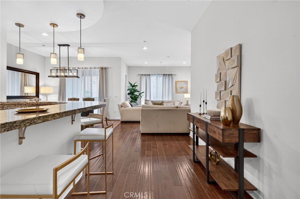 Granite countertops and cherry wood flooring. - 21 Gramercy 218, Irvine CA 92612 - photo 3