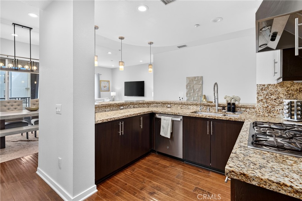kitchen opens to the living and dinning area. - 21 Gramercy 218, Irvine CA 92612 - photo 12