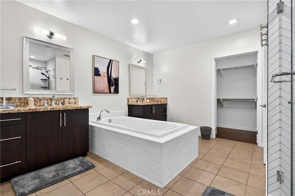 Primary Bathroom equipped with Stand up Shower and Bathtub. - 21 Gramercy 218, Irvine CA 92612 - photo 28