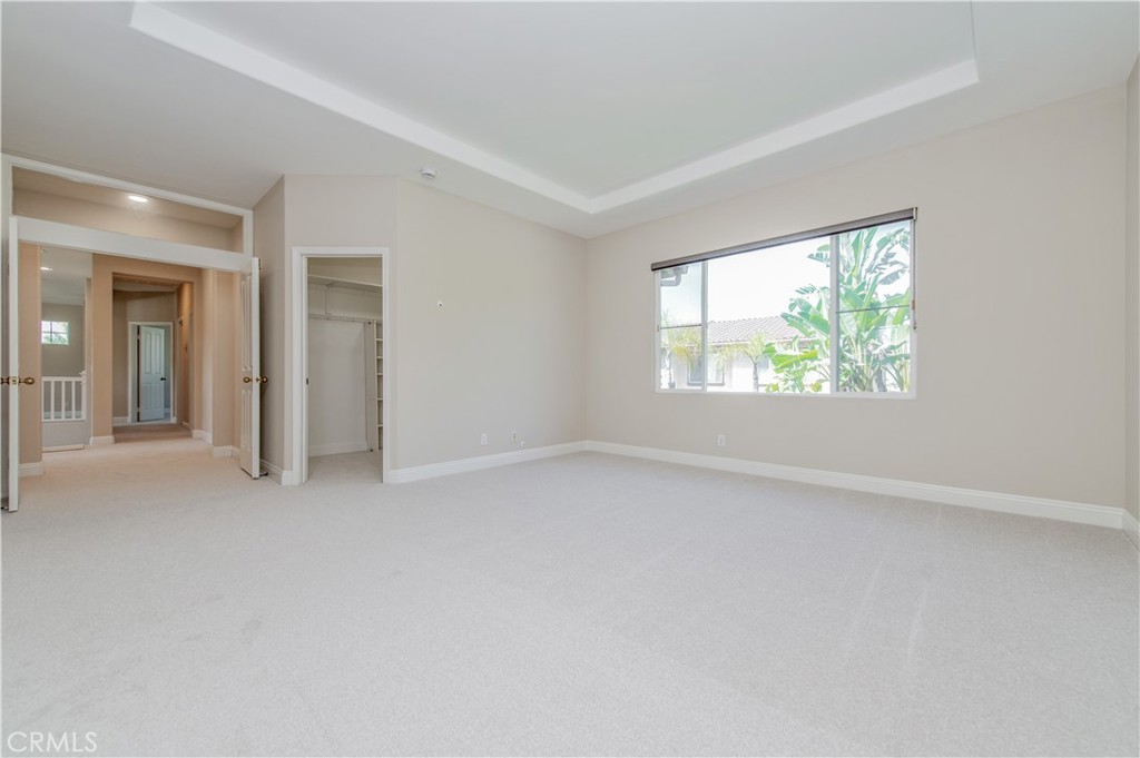 master bedroom with one of the walk in closet - 21 Sovente, Irvine CA 92606 - photo 38