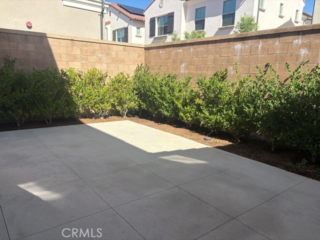 Fully landscaped rear yard with patio - 213 Birdseye, Irvine CA 92618 - photo 4
