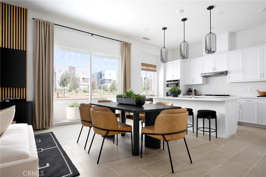 Model Photos: Photos shown are of the model home for this floor plan. Actual finishes, features, and landscaping may var - 217 Blue Wing, Irvine CA 92618 - photo 8