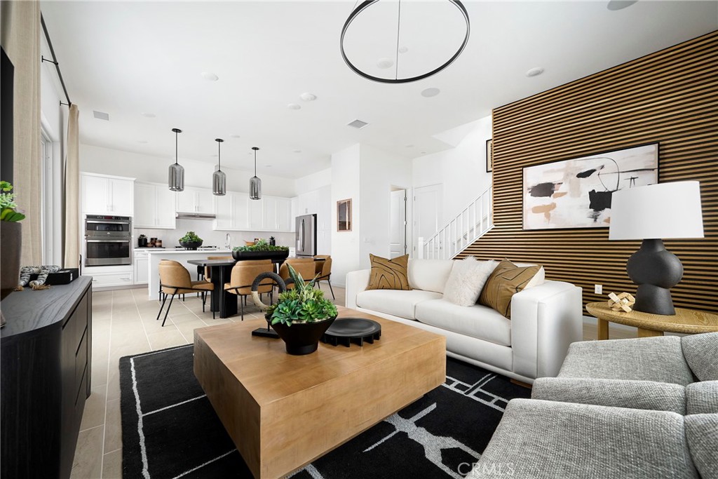 Model Photos: Photos shown are of the model home for this floor plan. Actual finishes, features, and landscaping may var - 217 Blue Wing, Irvine CA 92618 - photo 11