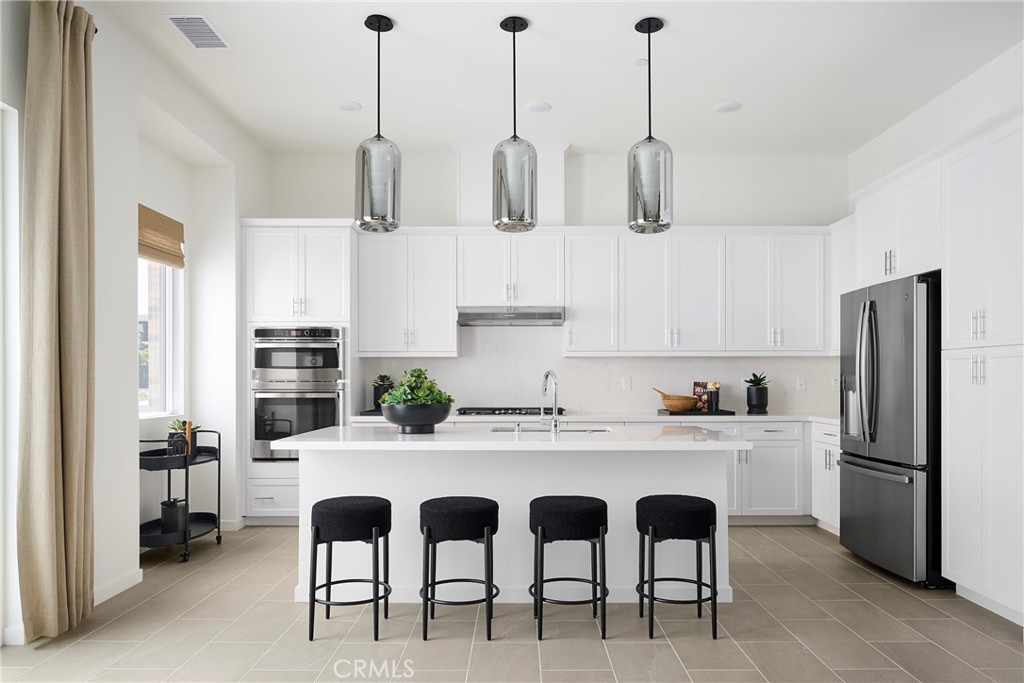 Model Photos: Photos shown are of the model home for this floor plan. Actual finishes, features, and landscaping may var - 217 Blue Wing, Irvine CA 92618 - photo 13