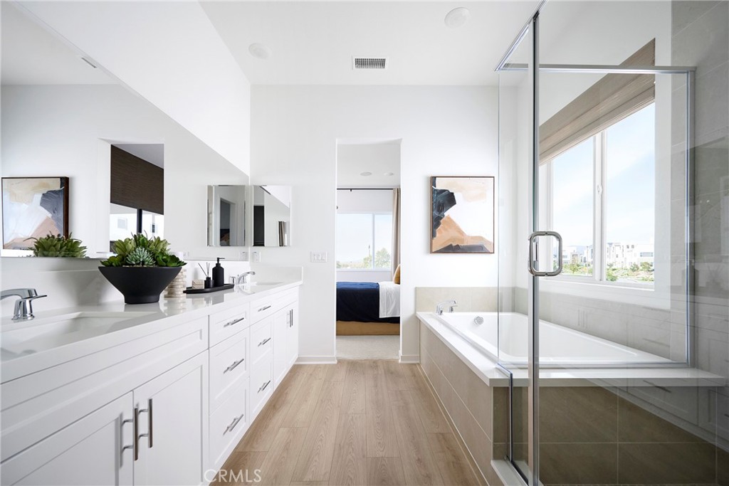 Model Photos: Photos shown are of the model home for this floor plan. Actual finishes, features, and landscaping may var - 217 Blue Wing, Irvine CA 92618 - photo 14