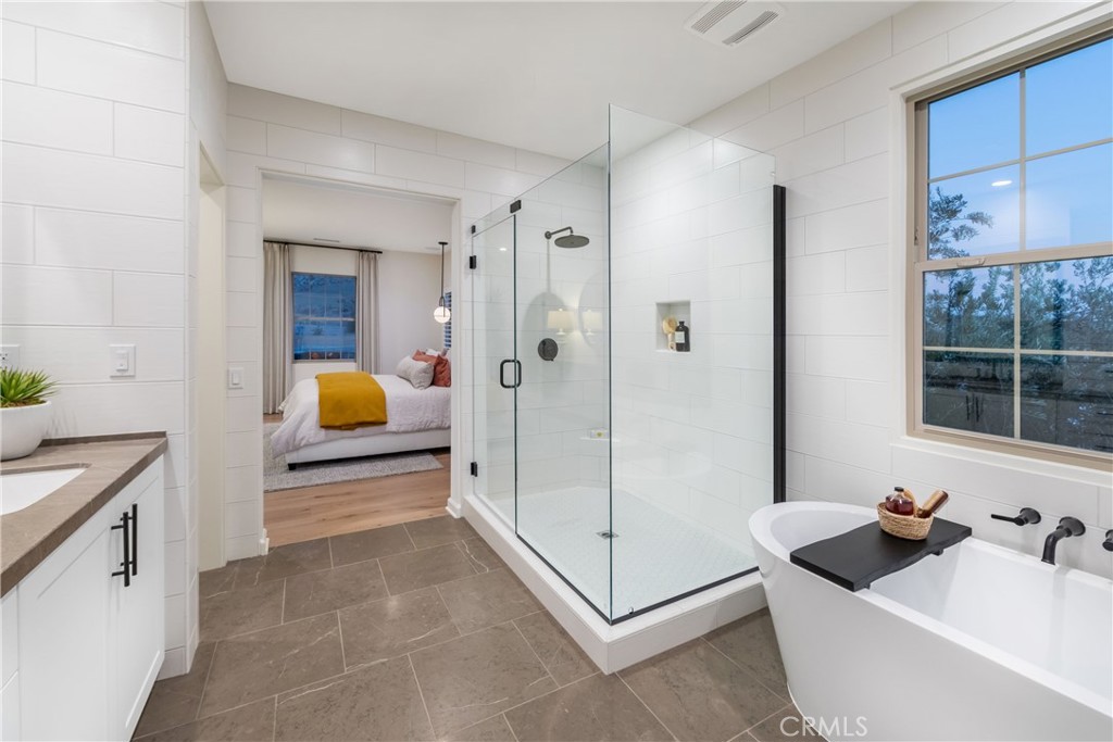 Primary bath suite. Model photo - 221 Canterbury, Irvine CA 92618 - photo 5