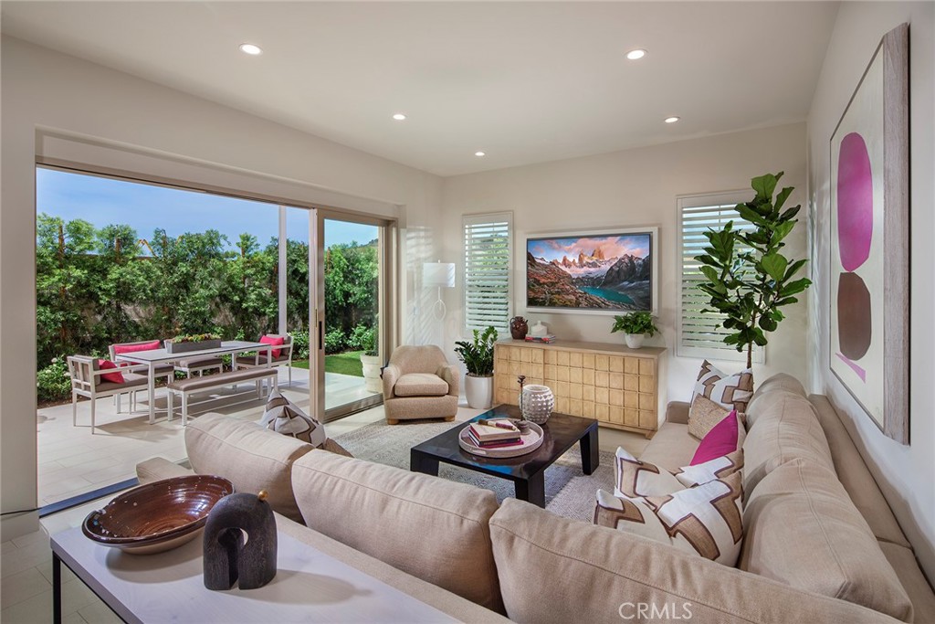 Model home great room with panorama doors - 223 Birdseye, Irvine CA 92618 - photo 2