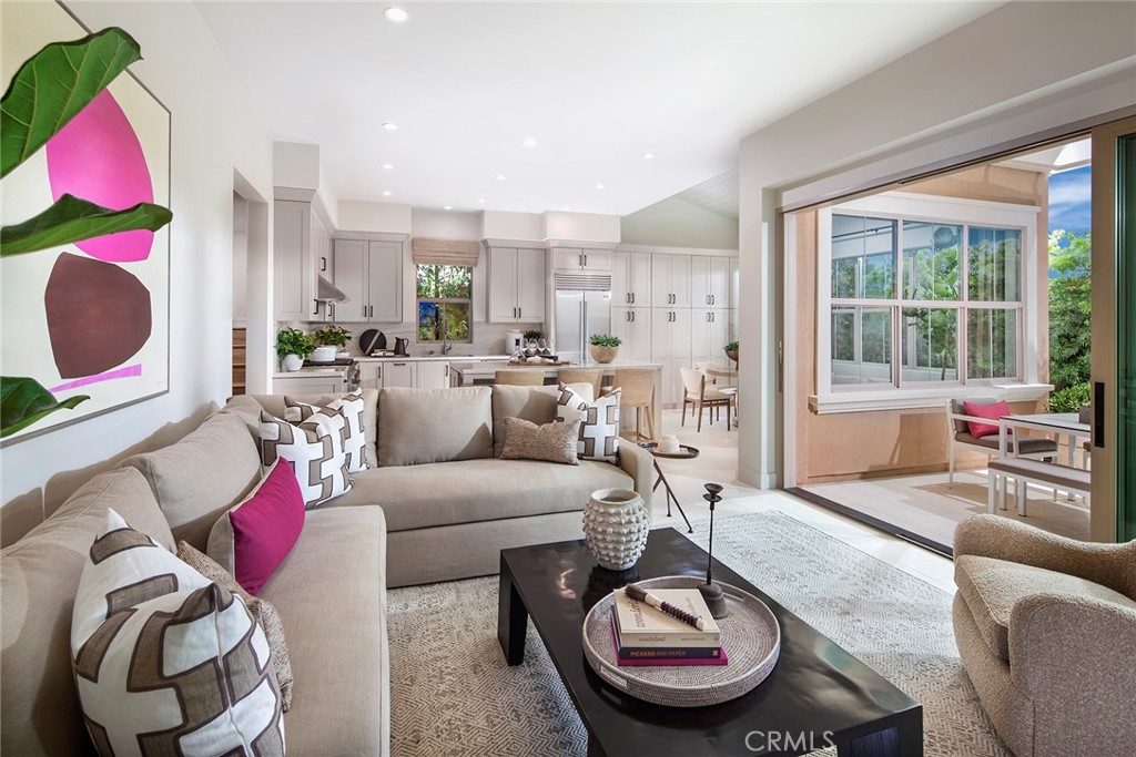 Great room open to kitchen, model photo - 223 Birdseye, Irvine CA 92618 - photo 3
