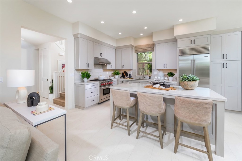 Generous island open to great room & dining area - 223 Birdseye, Irvine CA 92618 - photo 7