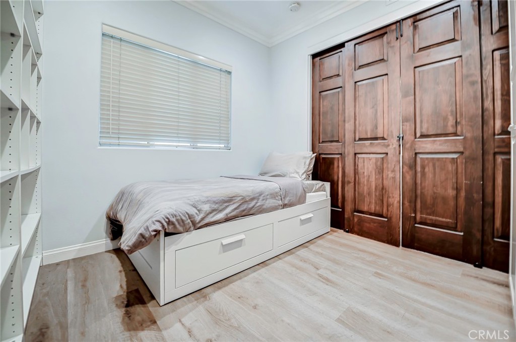 Den converted to a second bedroom with a beautiful wood sliding door. - 2243 Martin 314, Irvine CA 92612 - photo 14