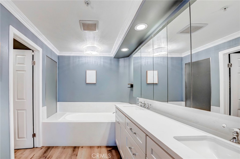 Primary bathroom with soaking tub and walk-in shower. - 2243 Martin 314, Irvine CA 92612 - photo 24