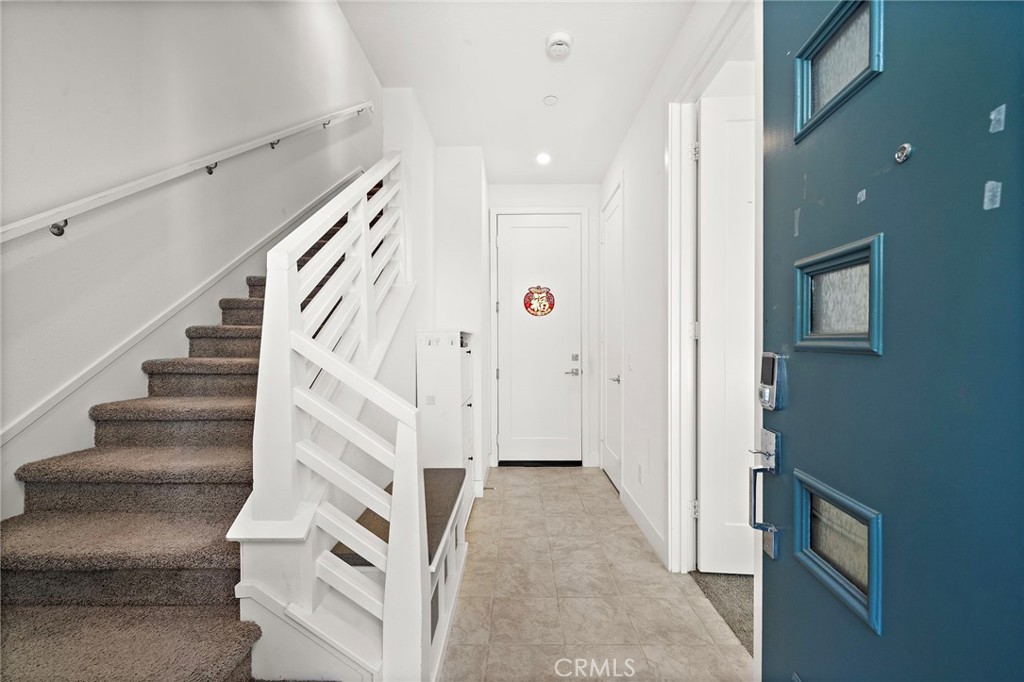 Tiled foyer connects to direct access garage - 230 Abacus, Irvine CA 92618 - photo 5