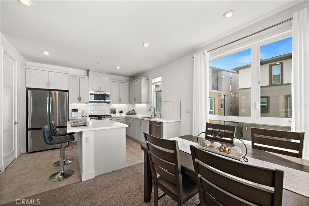 Large center island with bar seating - 230 Abacus, Irvine CA 92618 - photo 14
