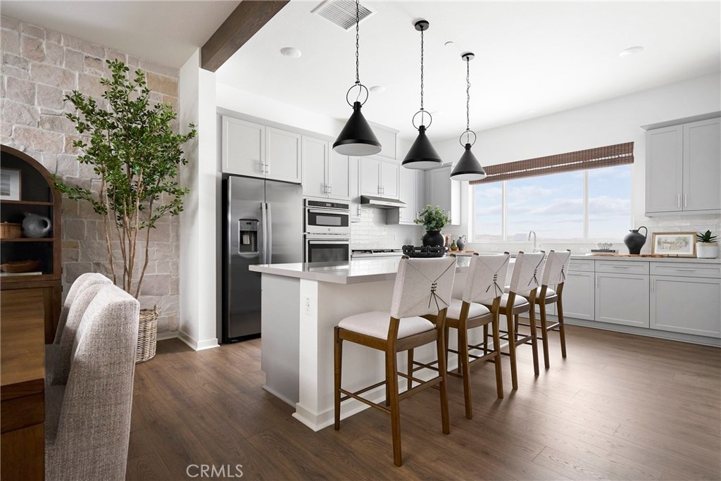 Model Photos: Photos shown are of the model home for this floor plan. Actual finishes, features, and landscaping may var - 233 Blue Wing, Irvine CA 92618 - photo 6
