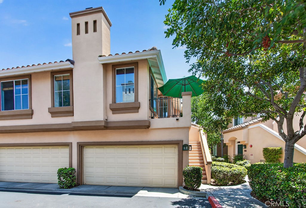 Home sits above a neighbor's garage - 2600 Ladrillo Aisle, Irvine CA 92606 - photo 2