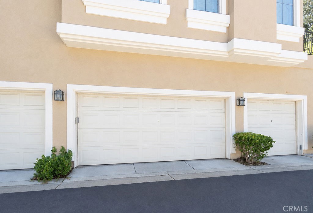 This home's two car garage is across the alley - 2600 Ladrillo Aisle, Irvine CA 92606 - photo 24