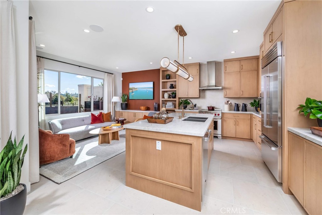 Open kitchen & Great Room in Plan 2 model home - 265 Raffini, Irvine CA 92618 - photo 2