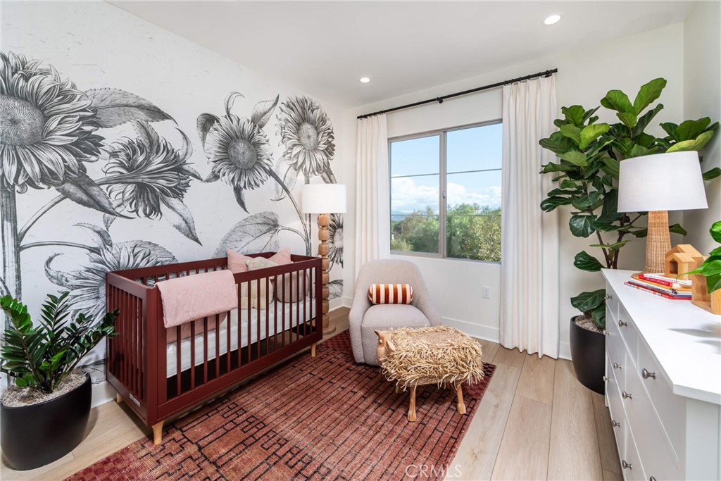 Roomy secondary bedroom in Plan 2 model home. - 265 Raffini, Irvine CA 92618 - photo 5