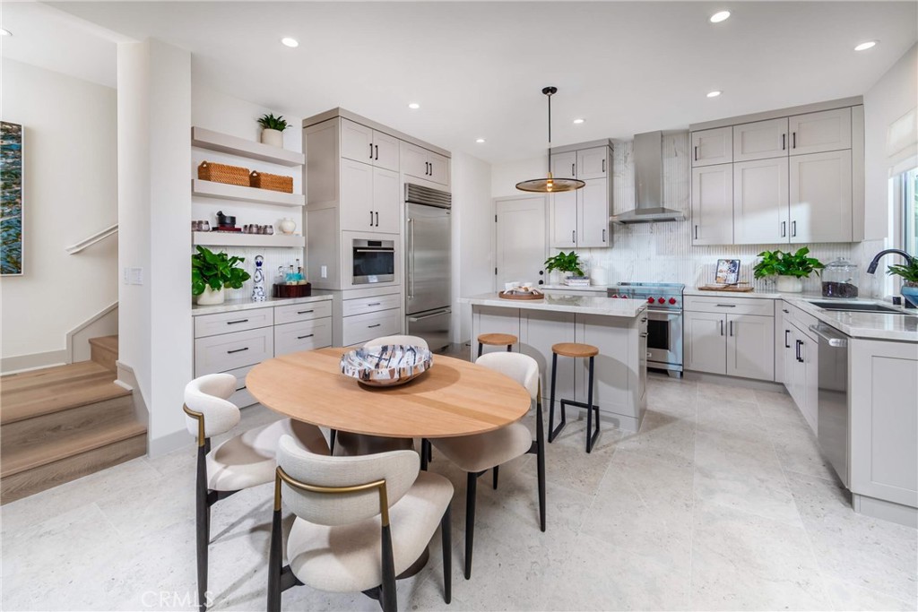 Plan 1 Model home open kitchen with dining area. - 269 Raffini, Irvine CA 92618 - photo 4