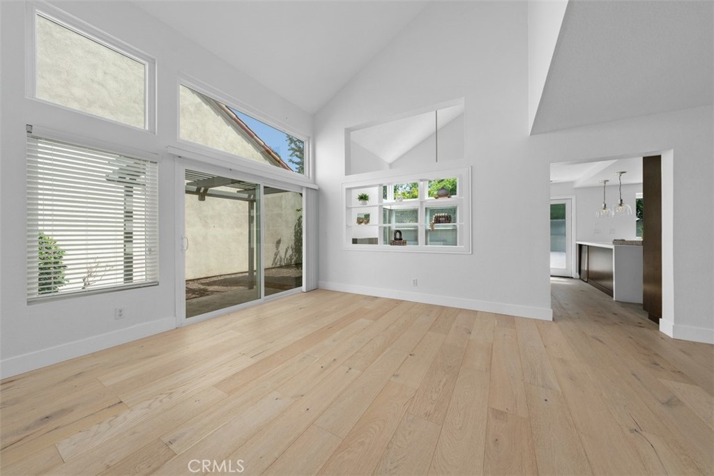 Living room with vaulted ceilings & lots of windows - 27 Almeria, Irvine CA 92614 - photo 4