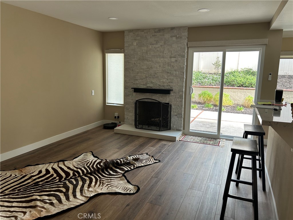 family room offers gas fireplace - 28 Lucero W, Irvine CA 92620 - photo 6
