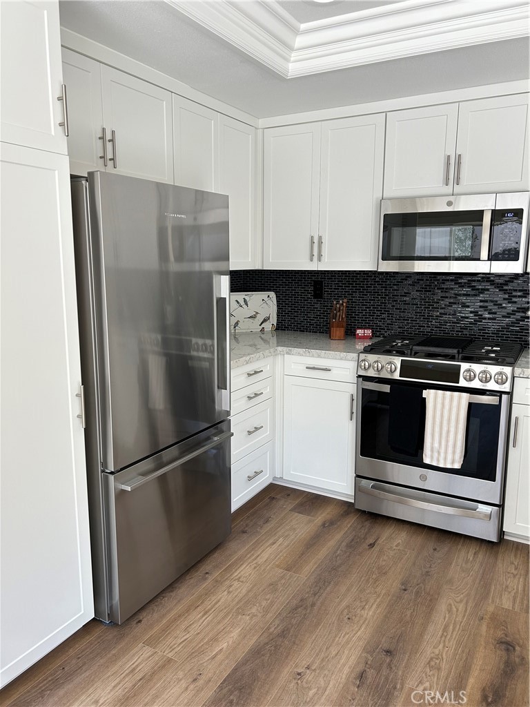 New kitchen with stainless steel appliances - 28 Lucero W, Irvine CA 92620 - photo 11